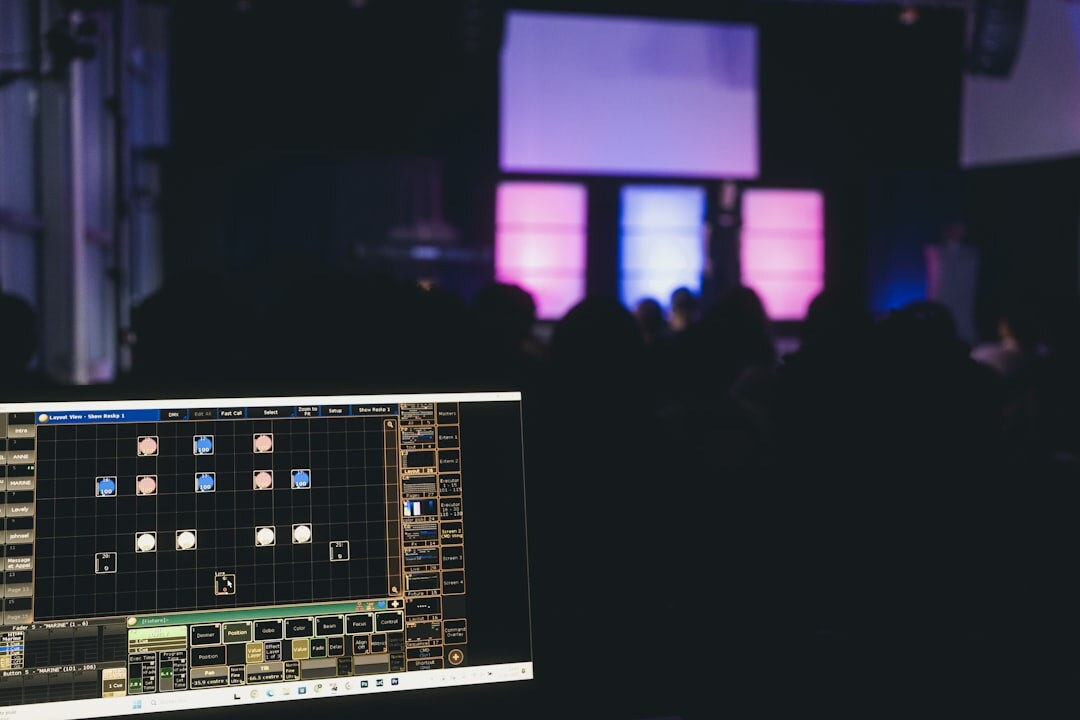Business conference with multiple speakers on stage and large screen